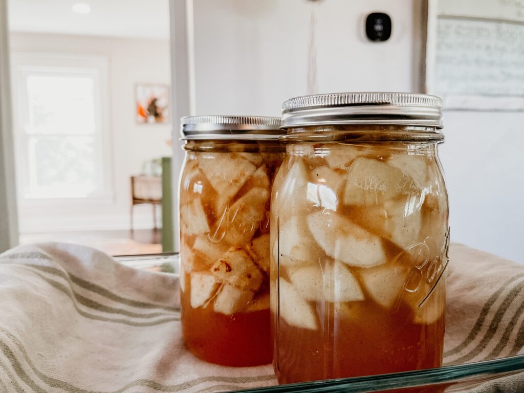 Preservation in progress: Two mason jars filled and sealed, preserving a delightful harvest for future enjoyment.