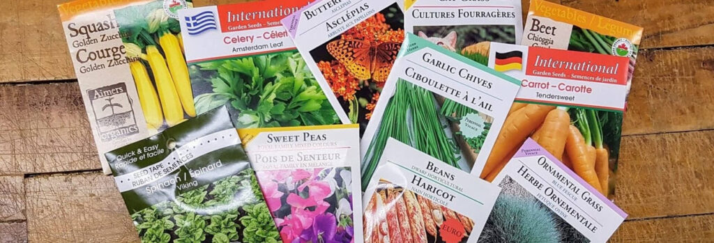 Seed packets spread out on a table.